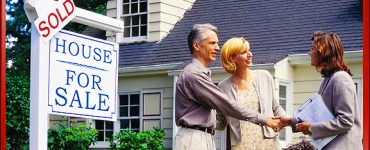 Couple Shaking Hands with Real Estate Agent