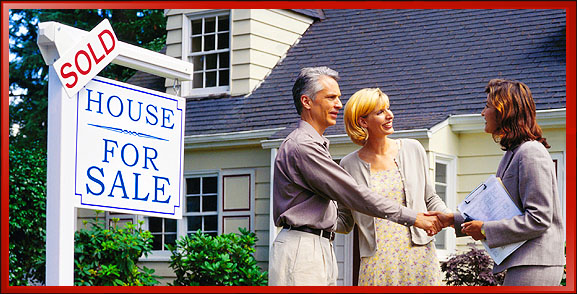 Couple Shaking Hands with Real Estate Agent