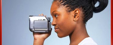 Woman Holding Camera One Hand