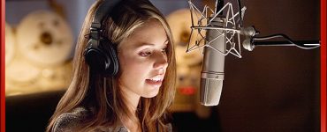 Woman Speaking Voice Over into Microphone