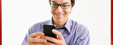 Guy with iPhone with Online Consumer Video