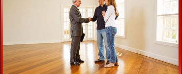 Real Estate Agent Touring Home with Young Couple