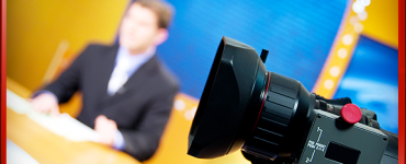 Businessman in Suit Interview and Camera Lens